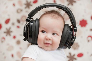 image of infant wearing headphones